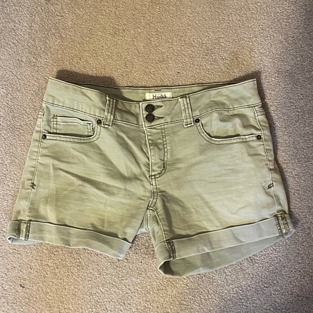 olive green denim shorts with rolled legs